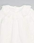 White structured cotton blouse with ruffled front and lace inserts