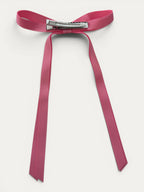 Classic long grosgrain bow clip for girls in Light Fuchsia; soft bright tone, elegant silhouette, made in Spain and shipped from Switzerland.