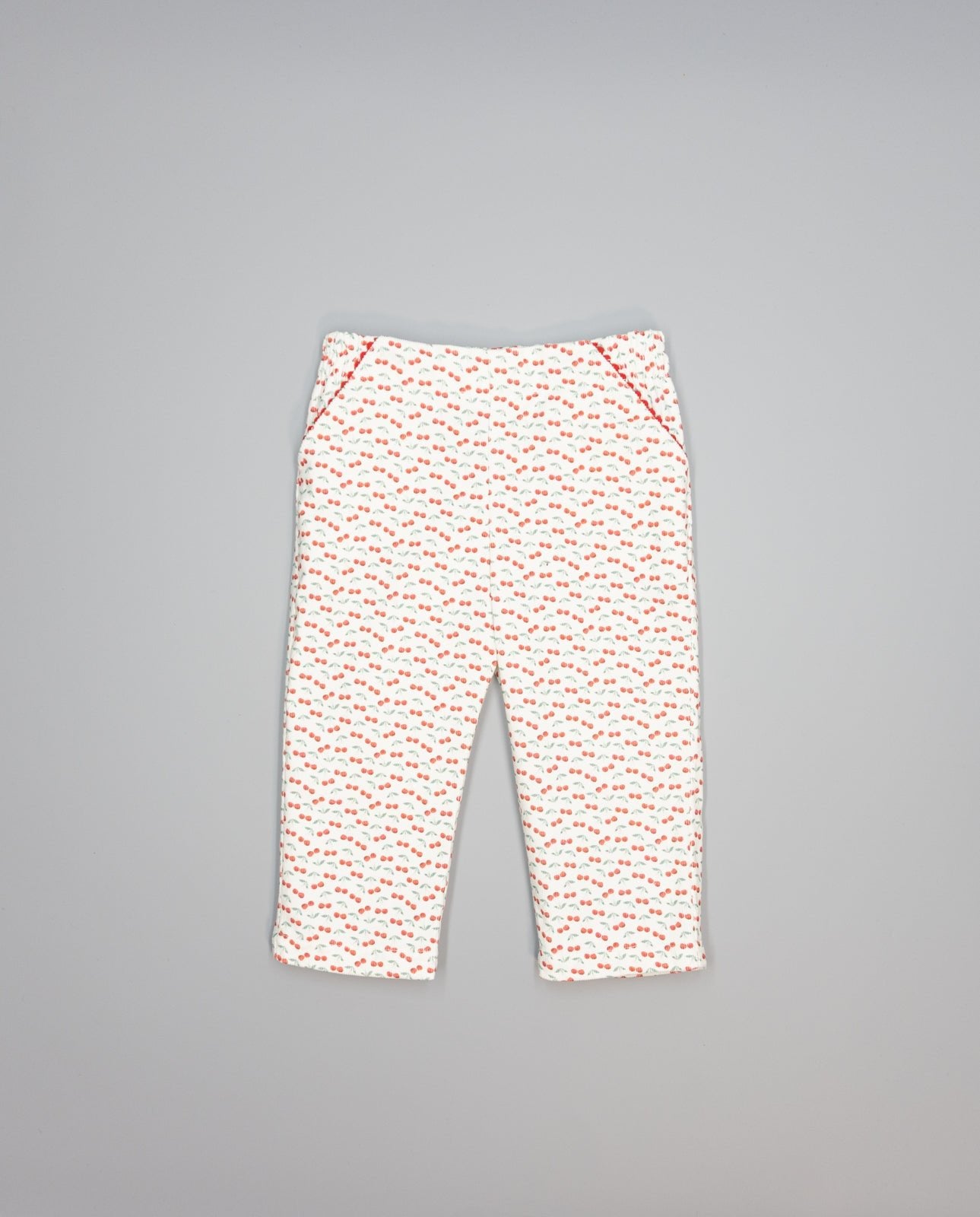 Corduroy trousers with cherry print and picot-trim pockets