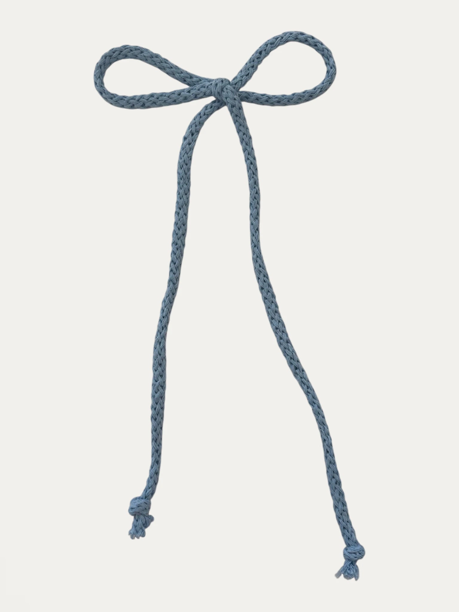 Long braided cotton hair cord for girls in Light Blue; pastel tone, elegant braided design, made in Spain and shipped from Switzerland.
