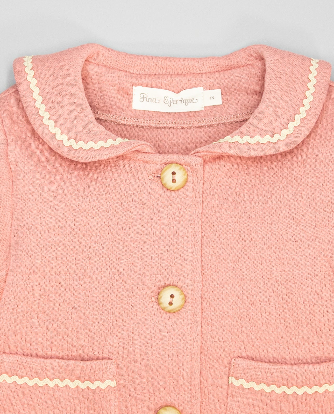 Girl pink fleece jacket with sailor collar and ric-rac trim