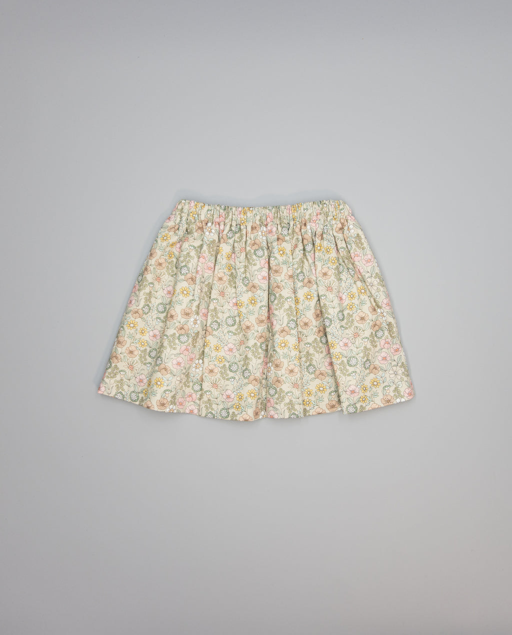 Beige floral viella gathered skirt with pockets trimmed in beige piping