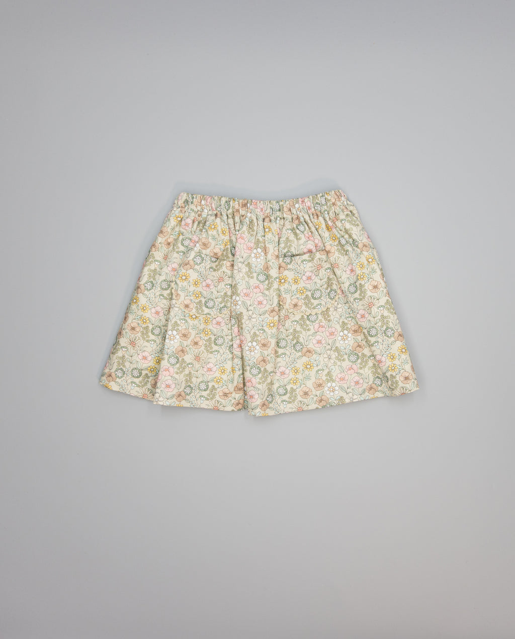Beige floral viella gathered skirt with pockets trimmed in beige piping