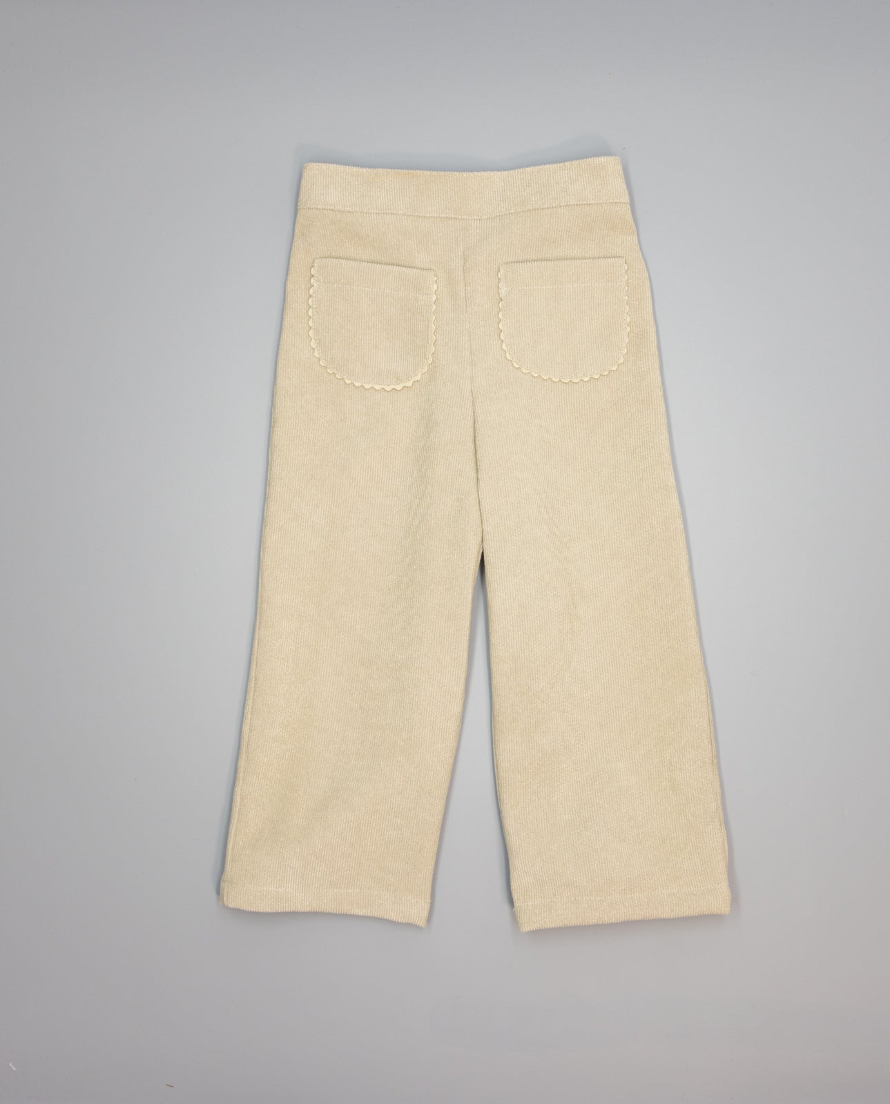 Girl corduroy trousers with patch pockets and ric-rac trim