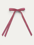 Classic long grosgrain bow clip for girls in Antique Rose; vintage tone, elegant silhouette, made in Spain and shipped from Switzerland.