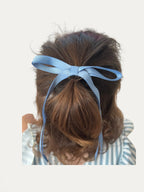 Classic long grosgrain bow clip for girls in Blue Moss; deep muted tone, elegant silhouette, made in Spain and shipped from Switzerland.