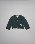 Dark green knitted kids cardigan with metallic bow and pearl initial button