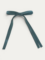 Classic long grosgrain bow clip for girls in Blue Moss; deep muted tone, elegant silhouette, made in Spain and shipped from Switzerland.