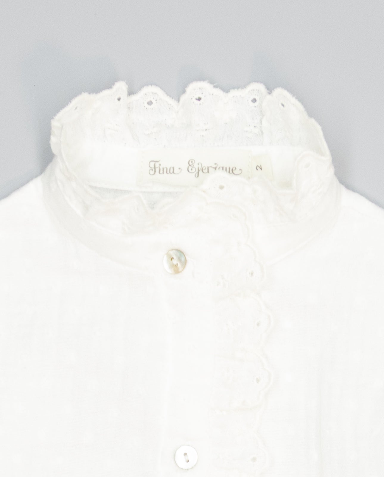 Beige girls cotton shirt with plumeti and embroidered ruffle
