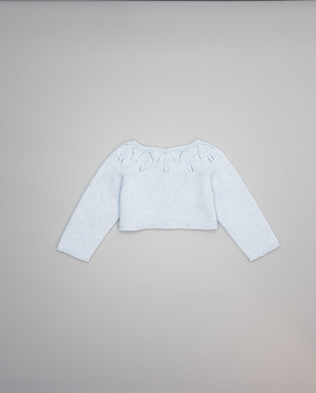 blue girls cashmere cardigan with eyelets and pearl buttons