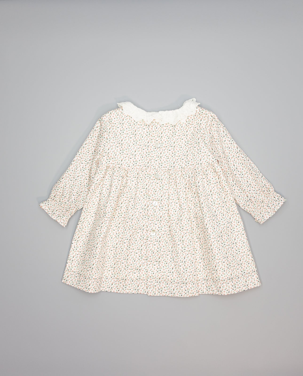 Baby pink floral viella dress with embroidered ruffled collar and long sleeves. 