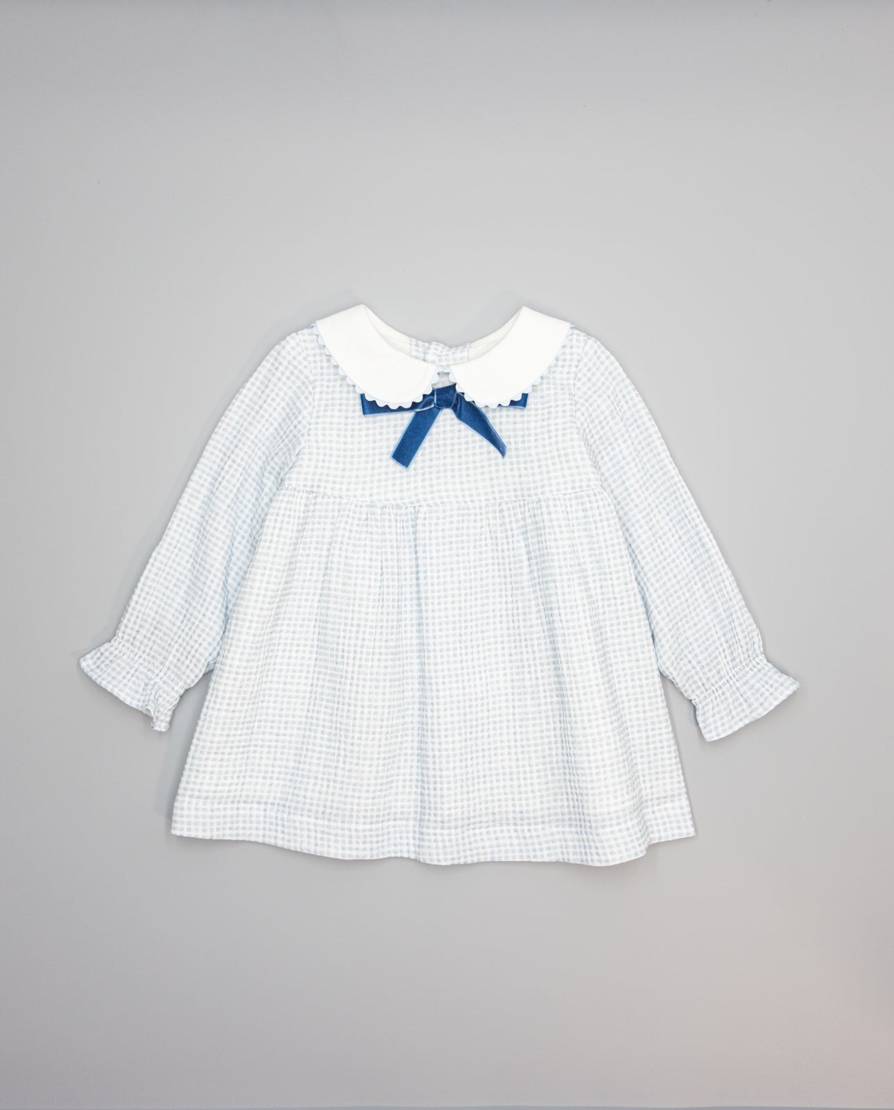 Baby girls blue gingham dress with white collar and contrast velvet bow