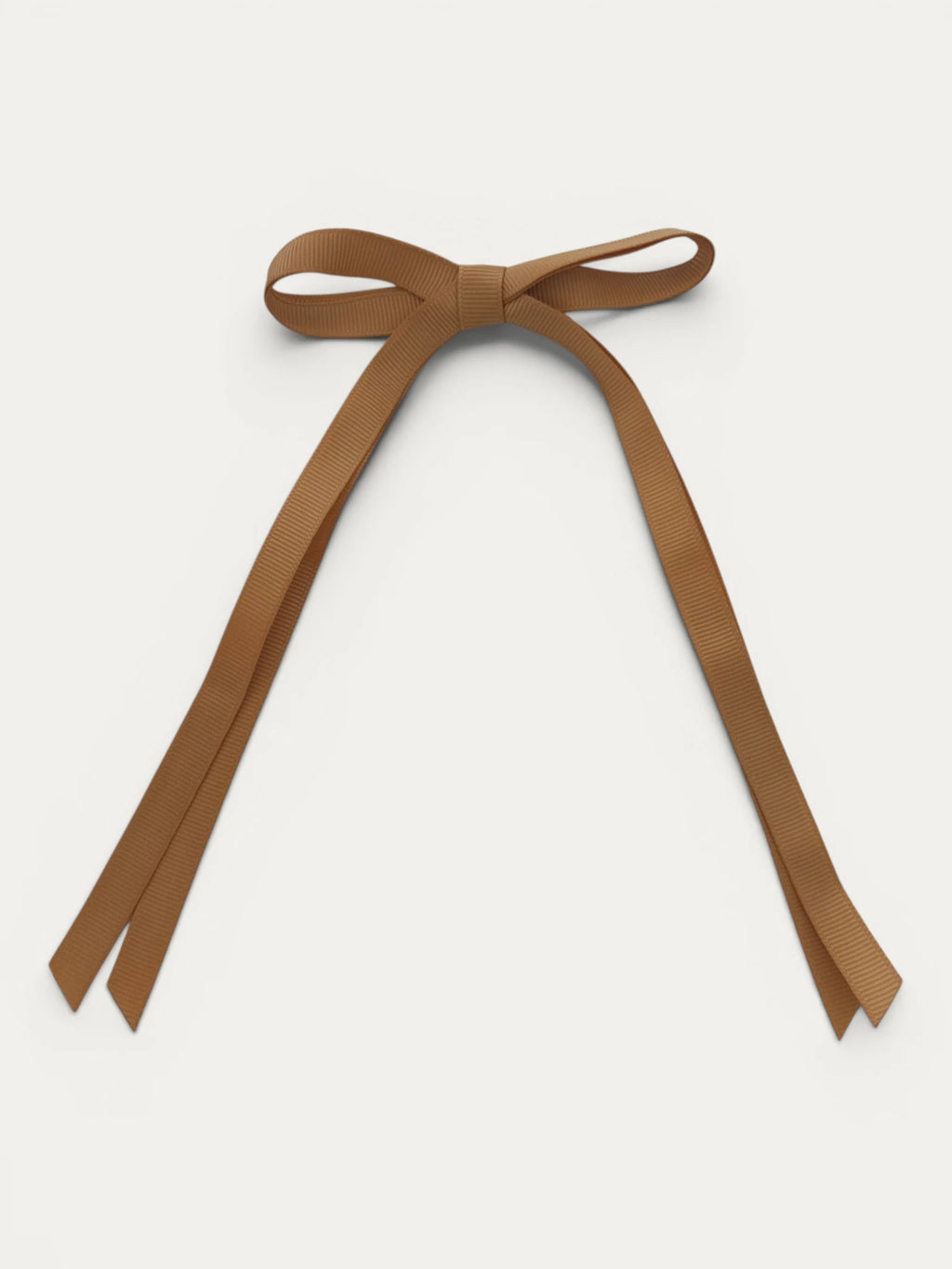 Classic long grosgrain bow clip for girls in Curry; warm tone, elegant silhouette, made in Spain and shipped from Switzerland.
