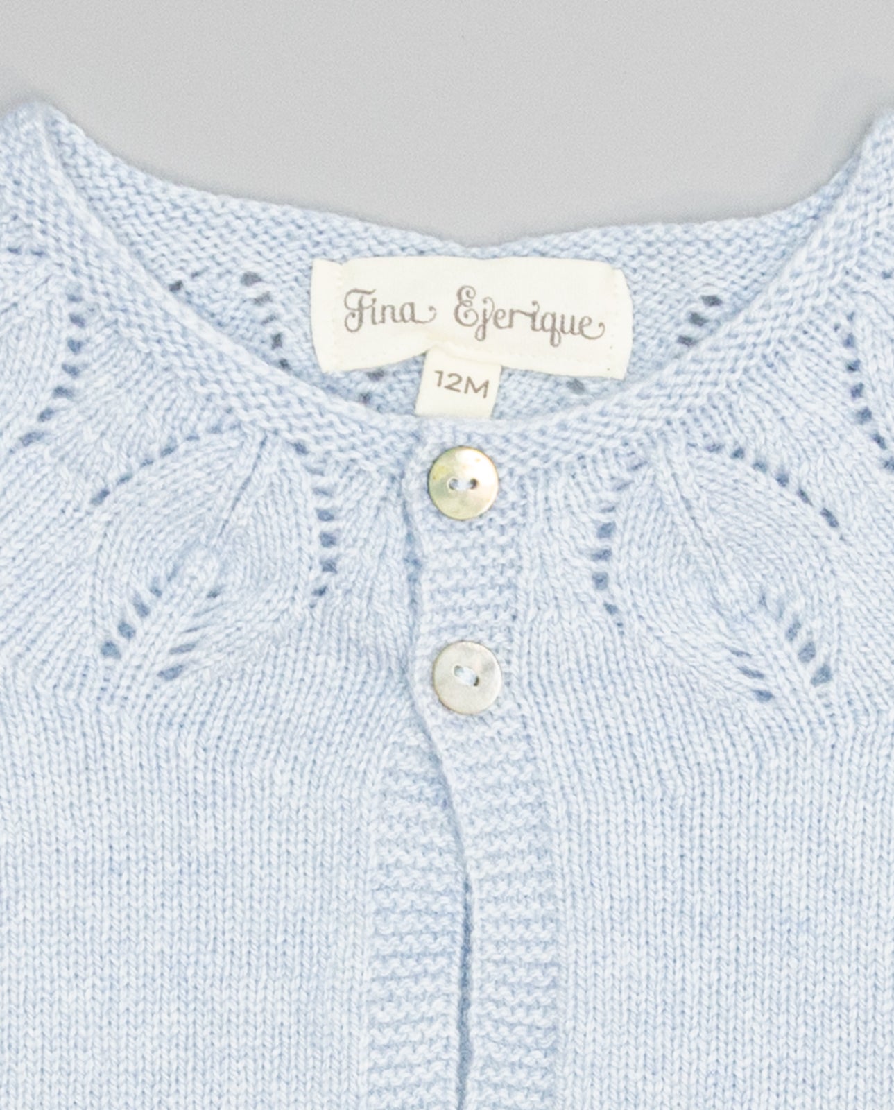 blue girls cashmere cardigan with eyelets and pearl buttons