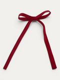 Classic long grosgrain bow clip for girls in Red; bright tone, elegant silhouette, made in Spain and shipped from Switzerland.