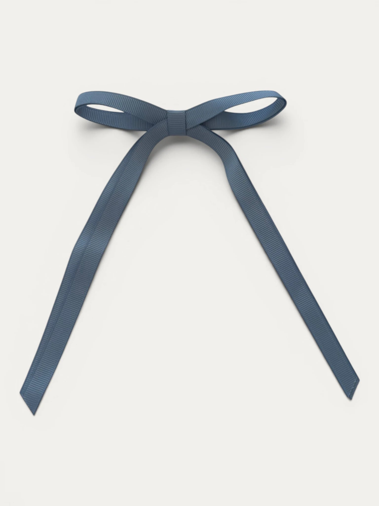 Classic long grosgrain bow clip for girls in French Blue; elegant silhouette, made in Spain and shipped from Switzerland.