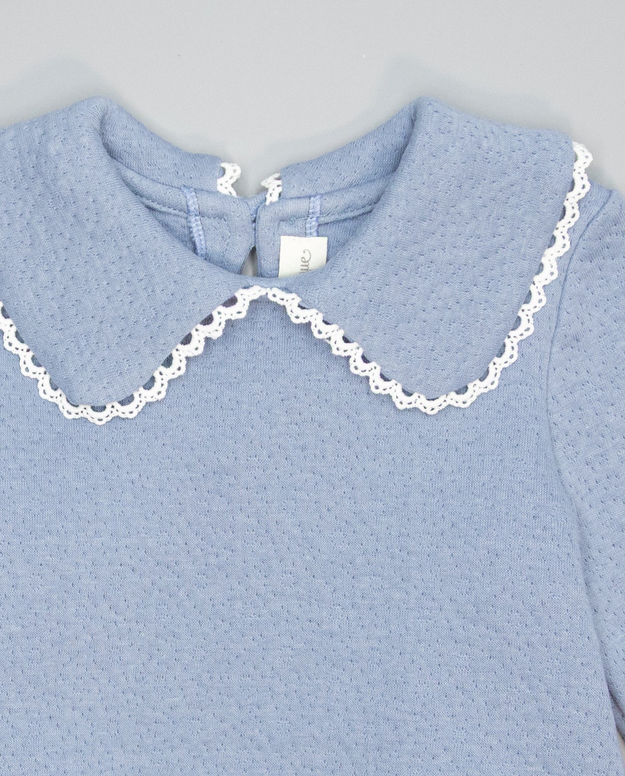 Blue textured knit sweater with guipure collar