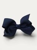 Fine grosgrain bow hair clip for girls; elegant texture, feminine silhouette, made in Spain and shipped from Switzerland.