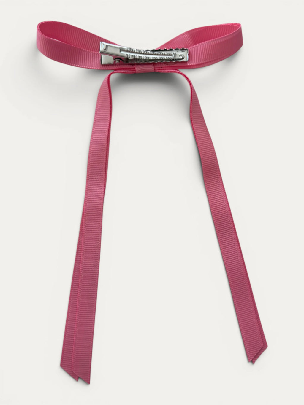 Classic long grosgrain bow clip for girls in Antique Rose; vintage tone, elegant silhouette, made in Spain and shipped from Switzerland.