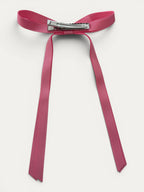 Classic long grosgrain bow clip for girls in Antique Rose; vintage tone, elegant silhouette, made in Spain and shipped from Switzerland.