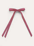 Classic long grosgrain bow clip for girls in Light Fuchsia; soft bright tone, elegant silhouette, made in Spain and shipped from Switzerland.