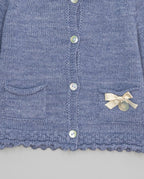 Blue knitted kids cardigan with metallic bow and pearl initial button