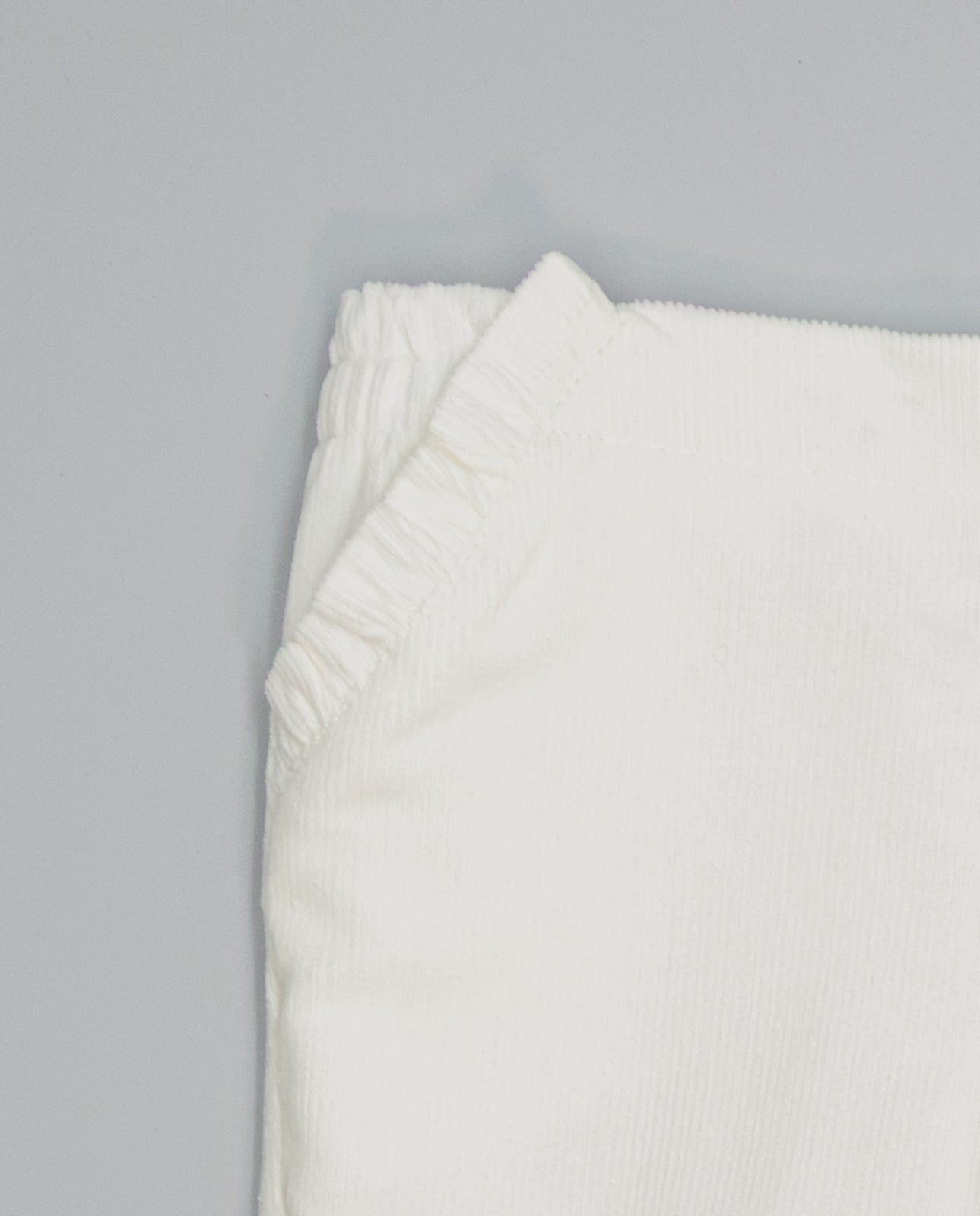 Girls corduroy trousers with ruffle detail on side pockets