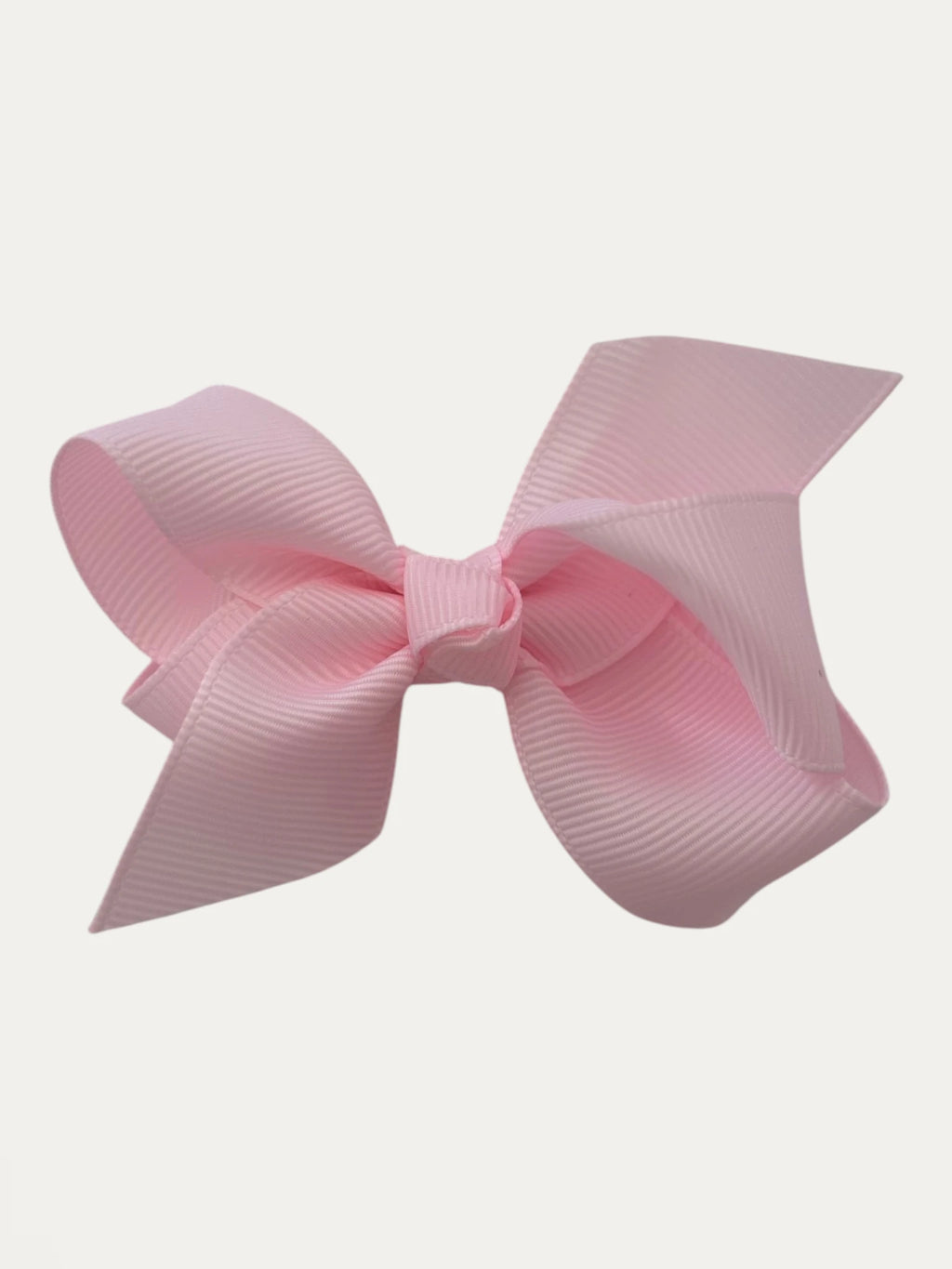 Fine grosgrain bow hair clip for girls; elegant texture, feminine silhouette, made in Spain and shipped from Switzerland.