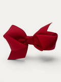 Fine grosgrain bow hair clip for girls; elegant texture, feminine silhouette, made in Spain and shipped from Switzerland.