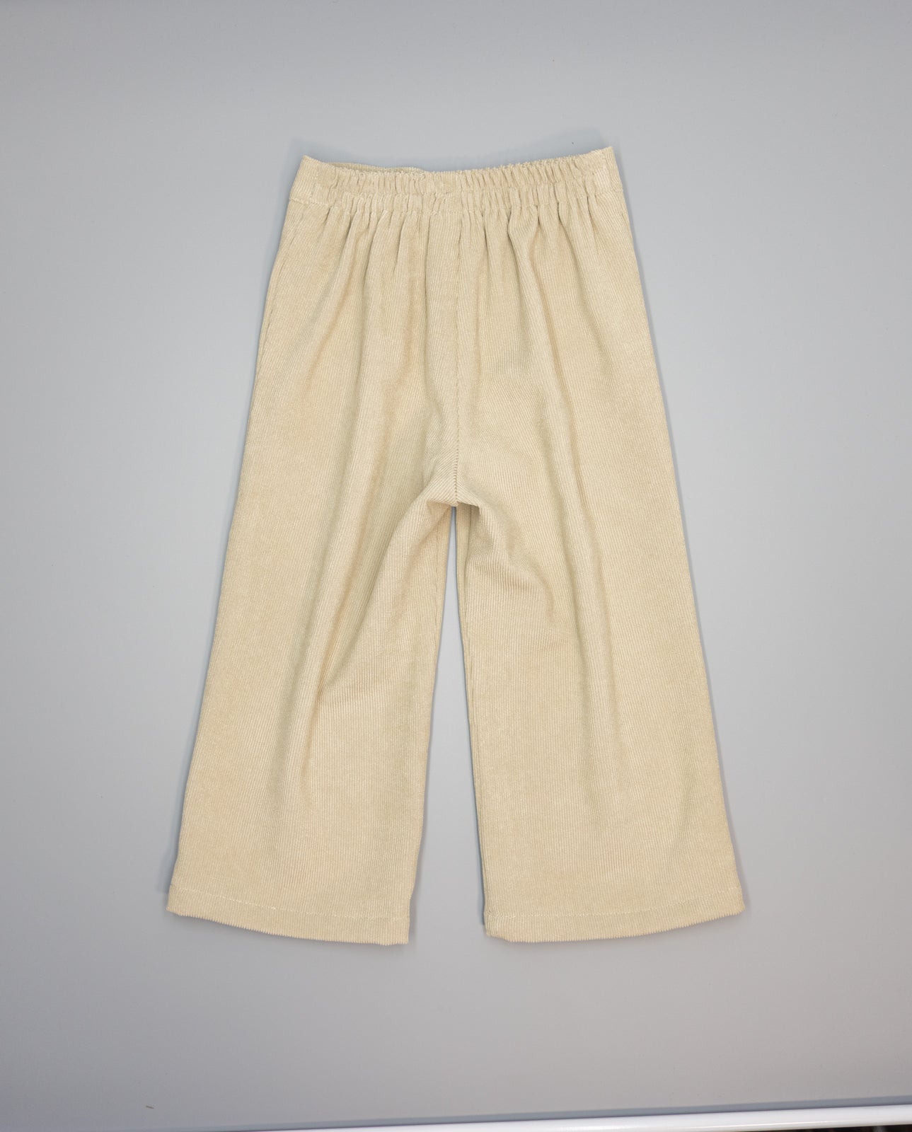 Girl corduroy trousers with patch pockets and ric-rac trim