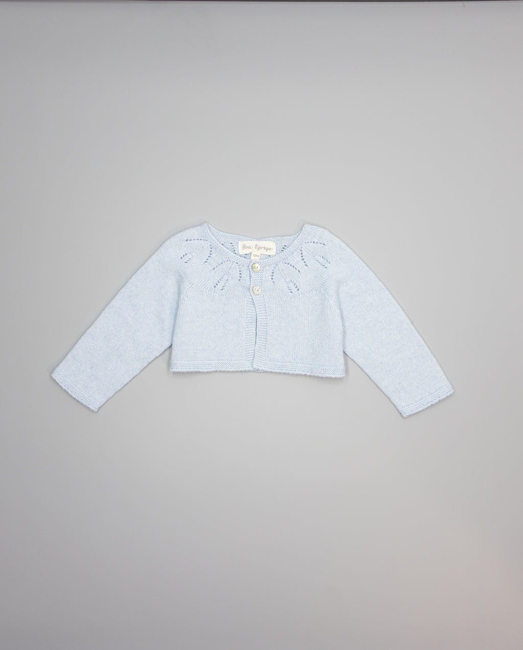 blue girls cashmere cardigan with eyelets and pearl buttons