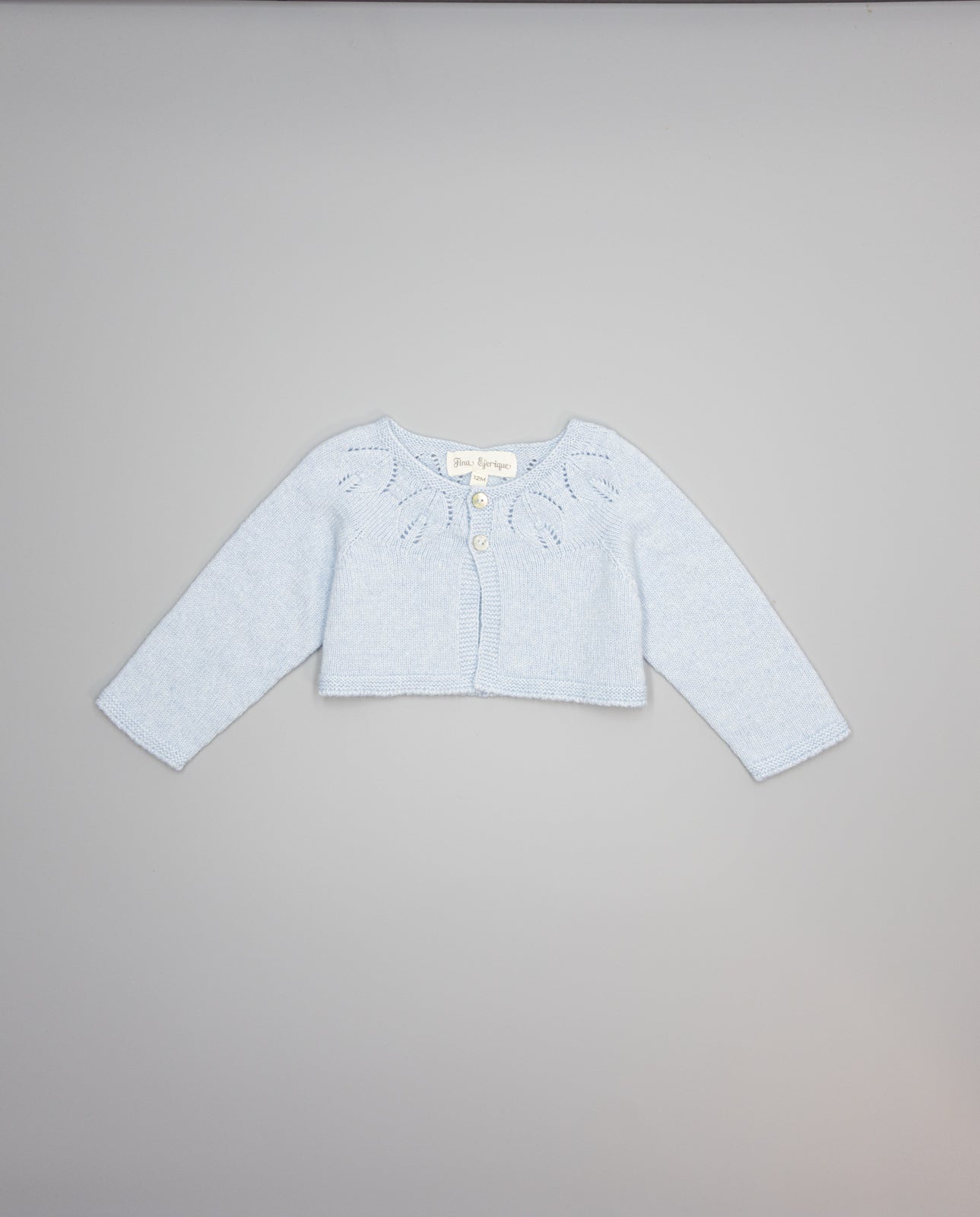 blue girls cashmere cardigan with eyelets and pearl buttons
