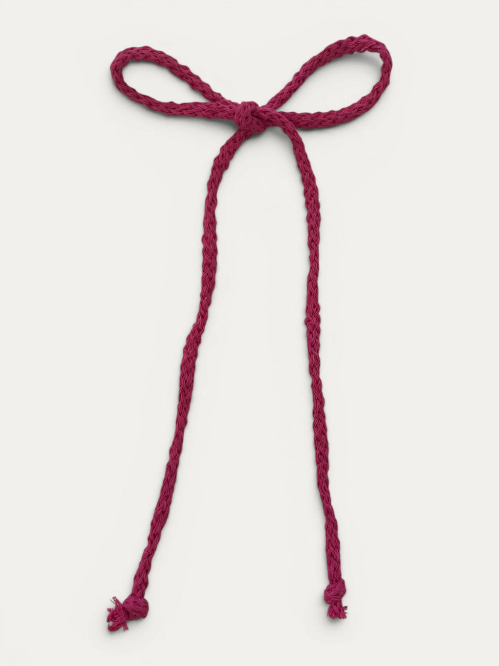 Long braided cotton hair cord for girls in Fuchsia; vibrant color, elegant braided design, made in Spain and shipped from Switzerland.