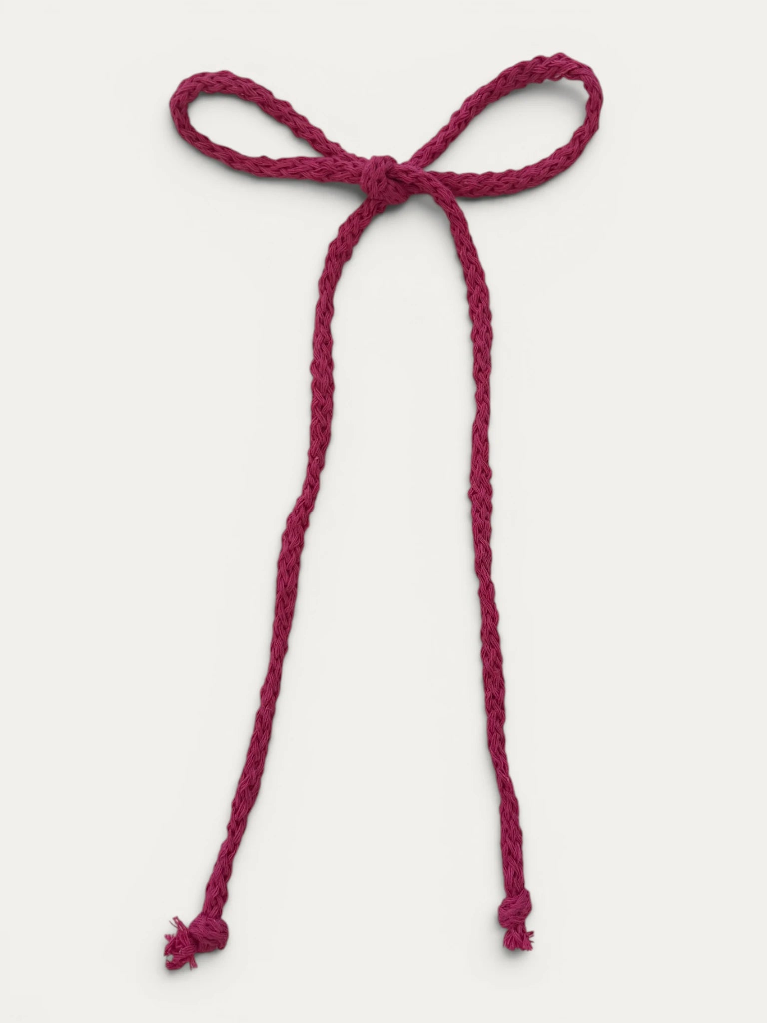 Long braided cotton hair cord for girls in Fuchsia; vibrant color, elegant braided design, made in Spain and shipped from Switzerland.